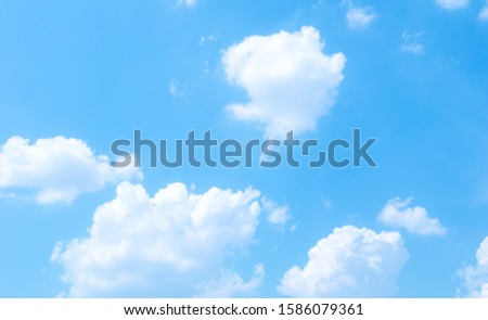 Abstract white fluffy clouds and  Blue sky in sunny day background.Natural Celestial World  concept with blue sky and clouds  Use as background.