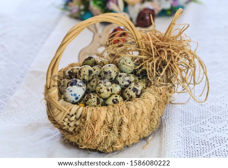 Rotten eggs in a basket of vegetable vibes on a tablecloth decorated with traditional Romanian motifs. Conceptual picture for diet food Easter Holiday