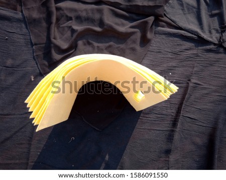 above view of non woven yellow color eco bags isolate on black background 