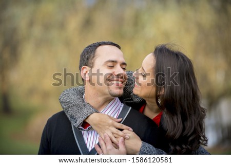 A shallow focus shot of a couple in love smiling at each other