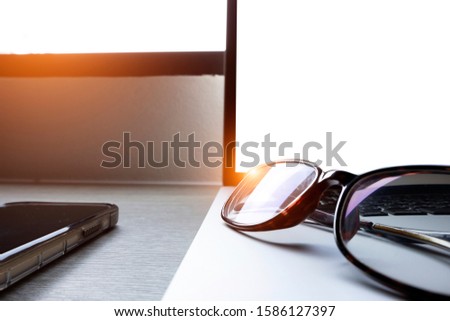 Mock up laptop with blank screen on table and smart phone, Online shopping concept.