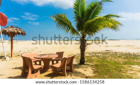 The scenic view of Batu Burok Beach in Kuala Terengganu during the day at Primula Hotel.