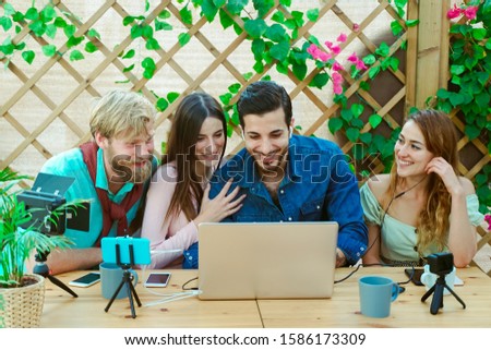 Millennial people streaming online using smartphone and laptop - Friendship party getting fun with social media - Social media, technology concept - Image