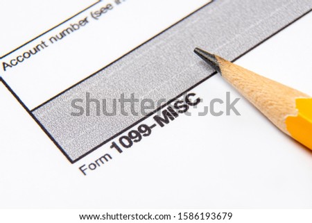 Tax Form 1099-misc on a white background. Royalty-Free Stock Photo #1586193679
