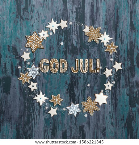 "God Jul" - "merry Christmas" wishes in Swedish or Norwegian. Text made of gingerbread cookies.