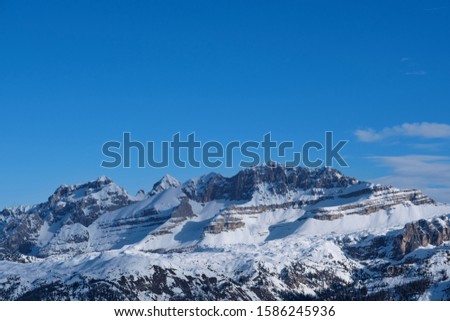 Panoramic aerial view of  Brenta Dolomites, Cima Tosa, Italy, snow on the slopes of the Alps  Madonna di Campiglio, Pinzolo, Italy. The most popular ski resorts in Italy. Aerial photography with drone