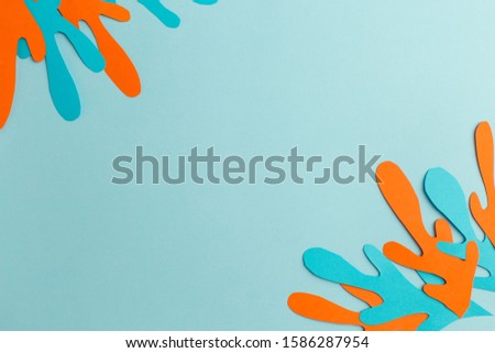 background of paper orange and blue abstraction, handmade, free space in the center