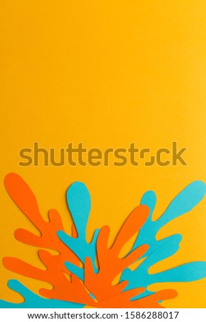 orange background of paper orange and blue abstraction, handmade, free space in the center