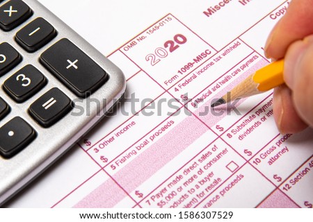 Tax Form 1099-misc on a white background. Royalty-Free Stock Photo #1586307529