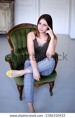 Stylish young woman in a good mood