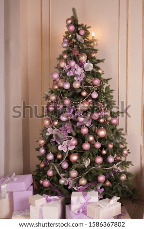 CHristmas decor in a room indoor with cozy furniture and fir tree