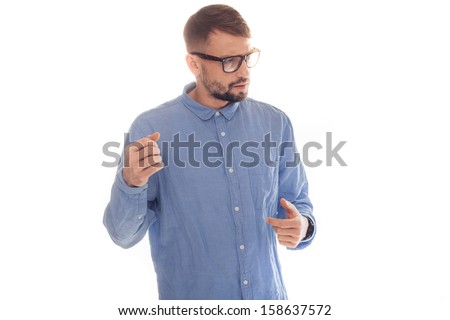 Nerdy looking young man giving a lecture or presentation wearing a blue shirt and glasses on a white background