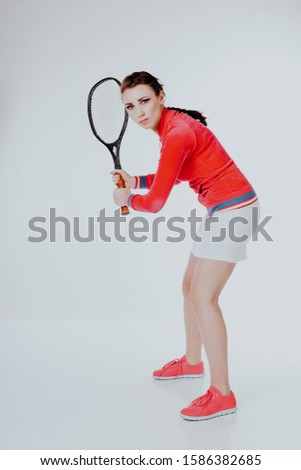 girl playing in the tennis racket sports