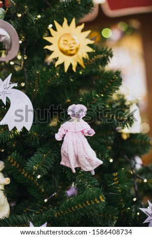 Christmas green tree decorated with cute mouse toys - a symbol of 2020