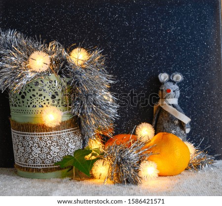 Christmas decorations on a dark background. Christmas rat Symbol of the new year 2020. Christmas card. Chinese New Year 2020. Christmas toys, bokeh. Happy New Year. New Year concept. Rat on the backgr