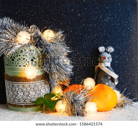 Christmas decorations on a dark background. Christmas rat Symbol of the new year 2020. Christmas card. Chinese New Year 2020. Christmas toys, bokeh. Happy New Year. New Year concept. Rat on the backgr