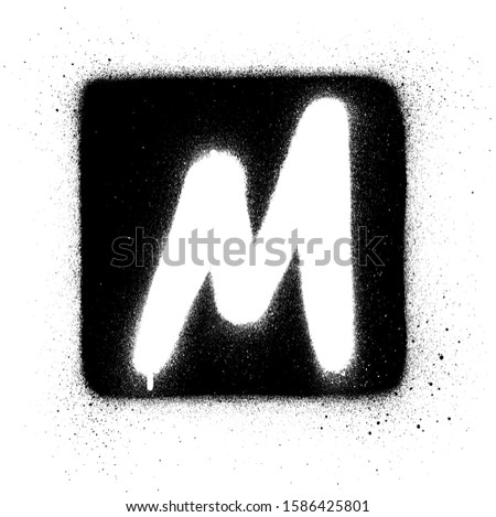 graffiti M font sprayed in white over black square