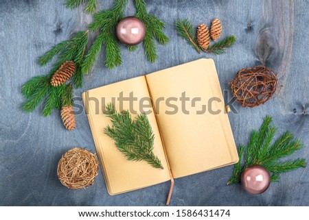 Christmas concept of writing goals, plans, letter to Santa Claus, wishes. Sheet of paper among decorations. Christmas, winter holidays, new year concept. Flat lay mockup for your art or hand lettering