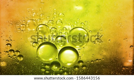 The circle from oil drops on the water surface is used as a pastel background image.