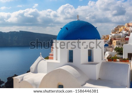 Blue and white domed churches on Santorini, Greece.