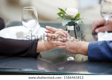 Hands of man and woman close up. Loving  couple holding hands