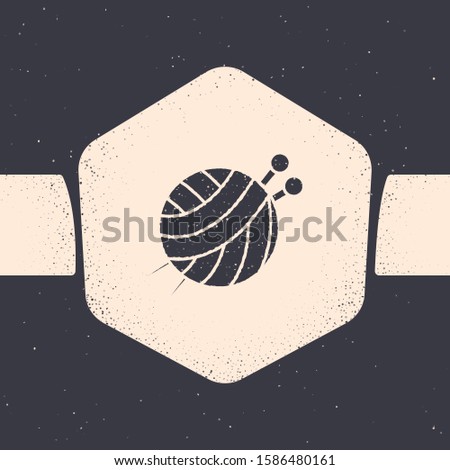 Grunge Yarn ball with knitting needles icon isolated on grey background. Label for hand made, knitting or tailor shop. Monochrome vintage drawing. 
