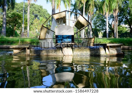 Low speed deep surface Chaipattana aerator designed by King Rama 9 of Thailand. Translation: "Lumpini, name of the park where this machine installed"