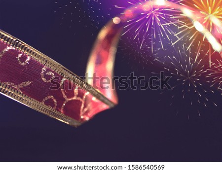 Christmas ribbon and fireworks and confetti