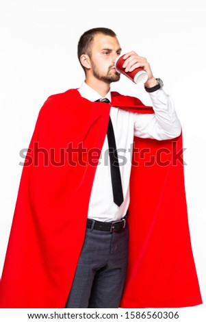 Businessman dressed like superhero drinking coffee