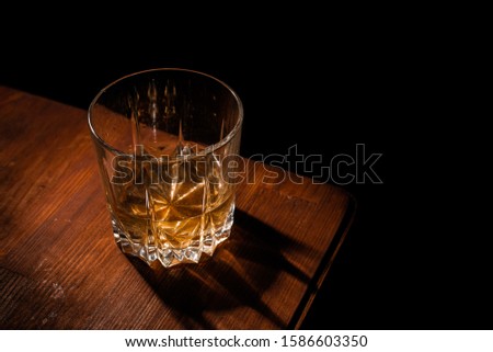 Alcohol focused on light wood background
