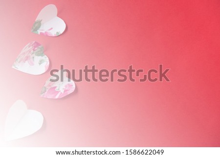 Paper heart over red background with copy space. Valentine's Day or Love concept