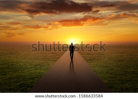 Man walking alone on a road