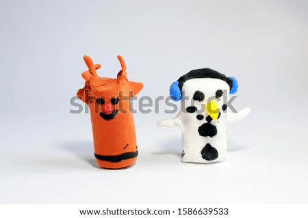 Children's creativity. Christmas fakes from air plasticine. Deer and snowman