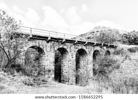 The historic Five Arch Railway Bridge over the Elands River near Waterval Boven in Mpumalanga. Monochrome