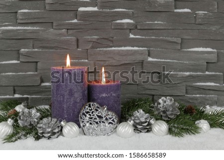 Advent decoration in front of a wall