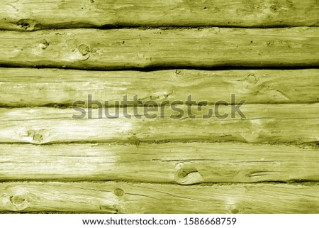 Weathered wooden fence in yellow tone. Abstract background and texture for design.