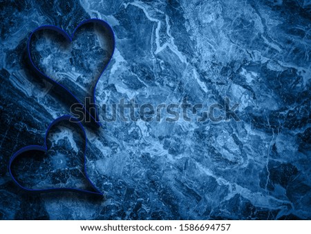 blue paper hearts on background. Love and Valentine's day concept.
