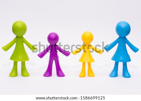 Concept of a gay lgbt family with children, colorful meeples isolated on white