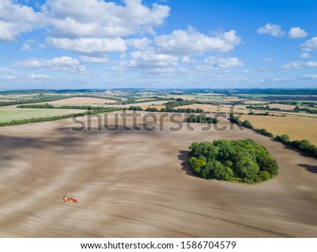 Aerial View Of Tractor Pulling Drill Sowing Wheat Seed