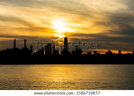 Silhouette of the Lower Manhattan Skyline on the East River in New York City during Sunset
