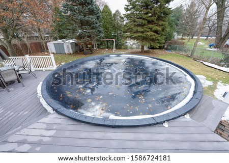 pool has been winterized and cover is in place Royalty-Free Stock Photo #1586724181