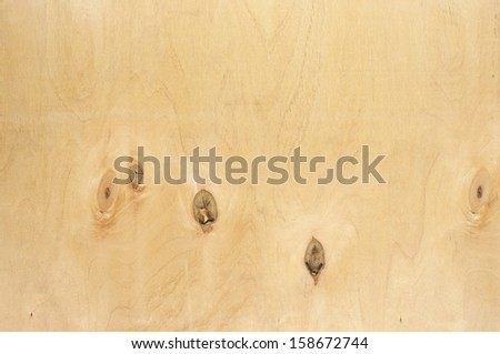 Natural knotted wood texture as background.