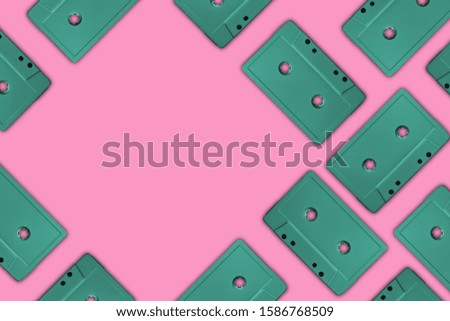 Beautiful Aqua Menthe magnetic cassette tapes flat background. Creative Concept Of Retro Style.