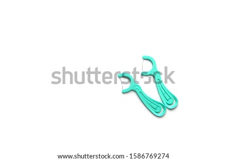 Tooth sticks with thread. Disposable Flosses. Tooth sticks with thread on isolate.