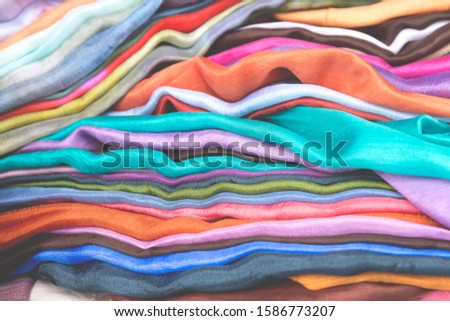 Colorful silk scarves close up. Set of silk fabrics.