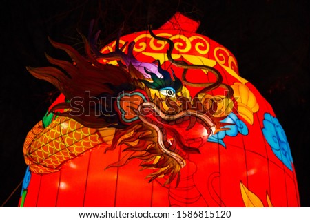 Colorful silk chinese lantern figures demonstrate traditions of Russian and Chinese culture and New Year's mood