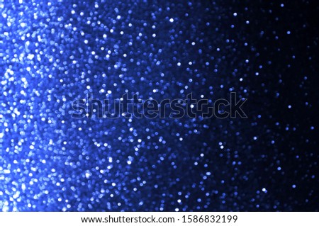 Soft image abstract bokeh dark blue,navy blue with light background.Blue,black color night light elegance,smooth backdrop,artwork design for new year,Christmas sparkling glittering or special day.