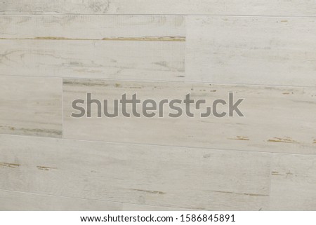 Background of a white wooden wall from modern tiled blocks in room. Finish wall tiles abstract texture. Luxury light themed background for interior and design. Small sharpness
