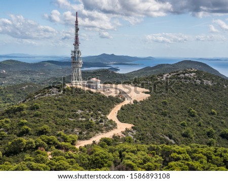 The view of Ugljan island mountains and nature with transmission tower in the background. Ugljan, Zadar region, Coratia. Royalty-Free Stock Photo #1586893108