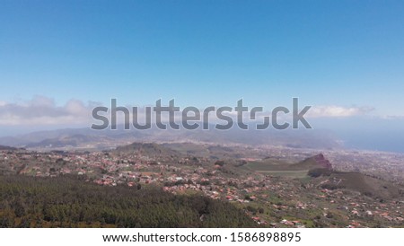 Aerial view - valley and distant mountains, clouds and ocean, Tenerife, Spain